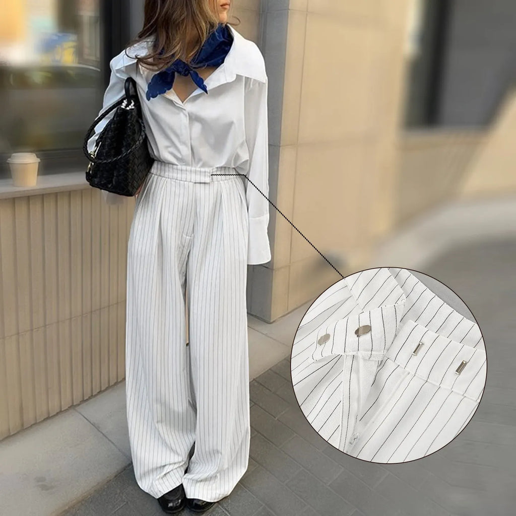 White striped women's wide-leg trousers with zip fastening and loose casual fit