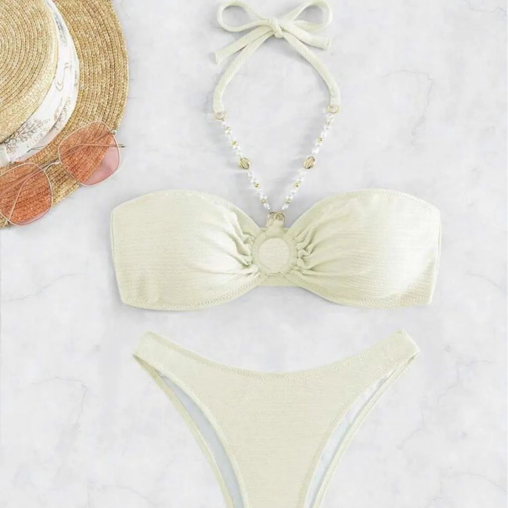 Women's halter-style bikini set in solid colour on a white background.