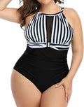 Women's black lace-trimmed one-piece swimsuit on a hanger