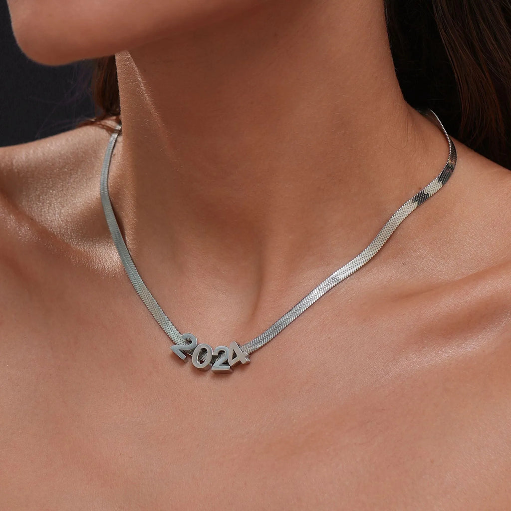 Gold and silver titanium steel personalised necklace showing number and letter pendant options on 40.5cm chain