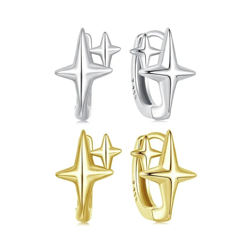Minimalist star-shaped silver ear clips with oxidation finish and contemporary design details
