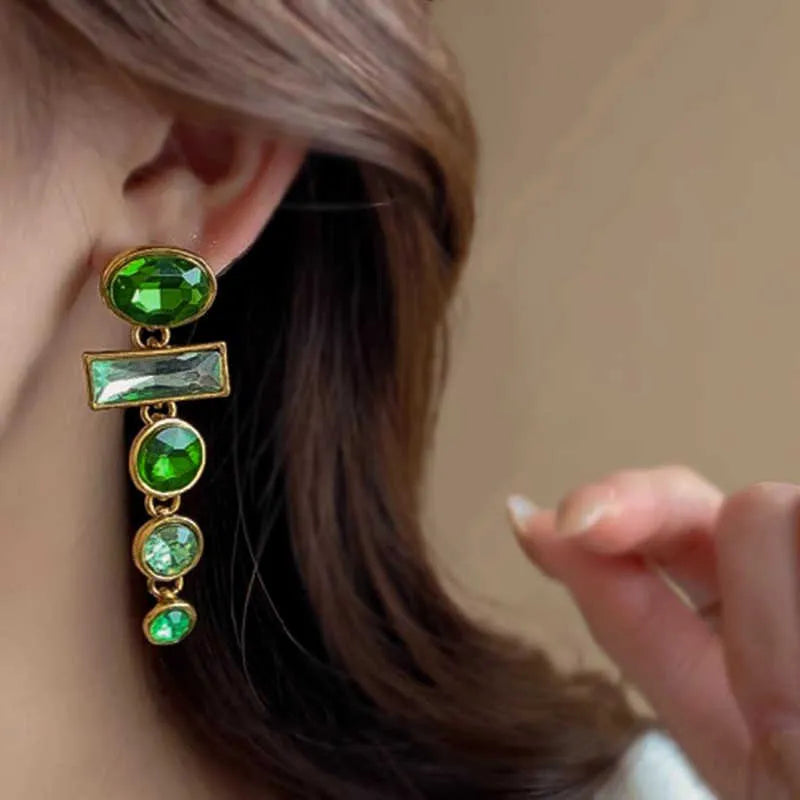 A pair of women's green gradient alloy drop earrings with a geometric tassel design and inlaid zircon stone.