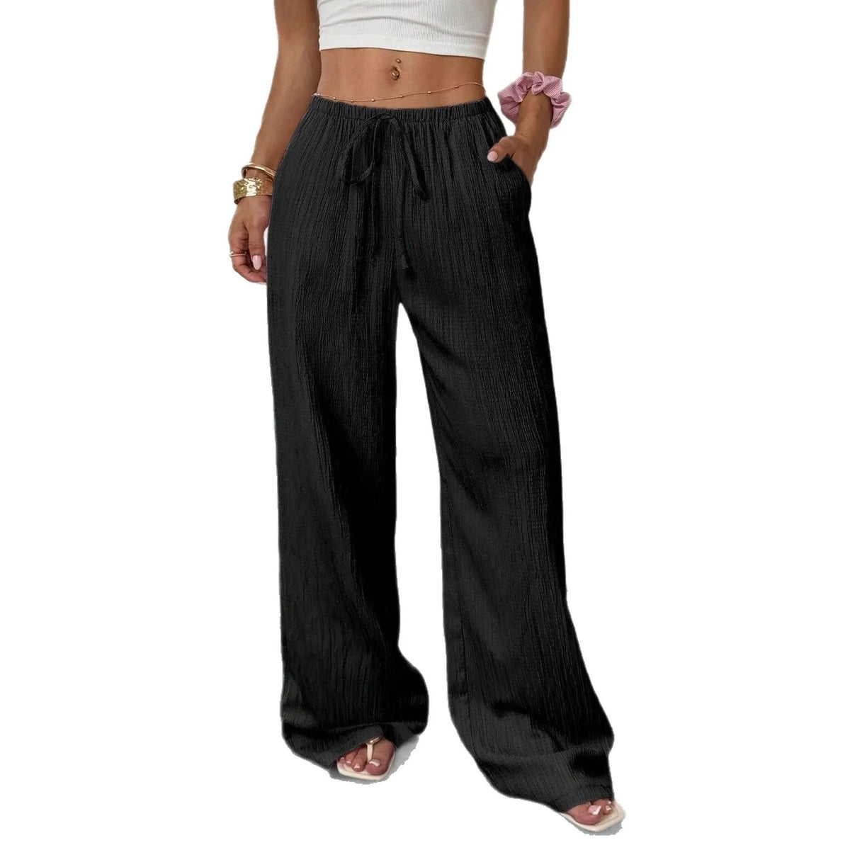Women's black wide-leg trousers with lace-up waist trimming detail on mid-waist