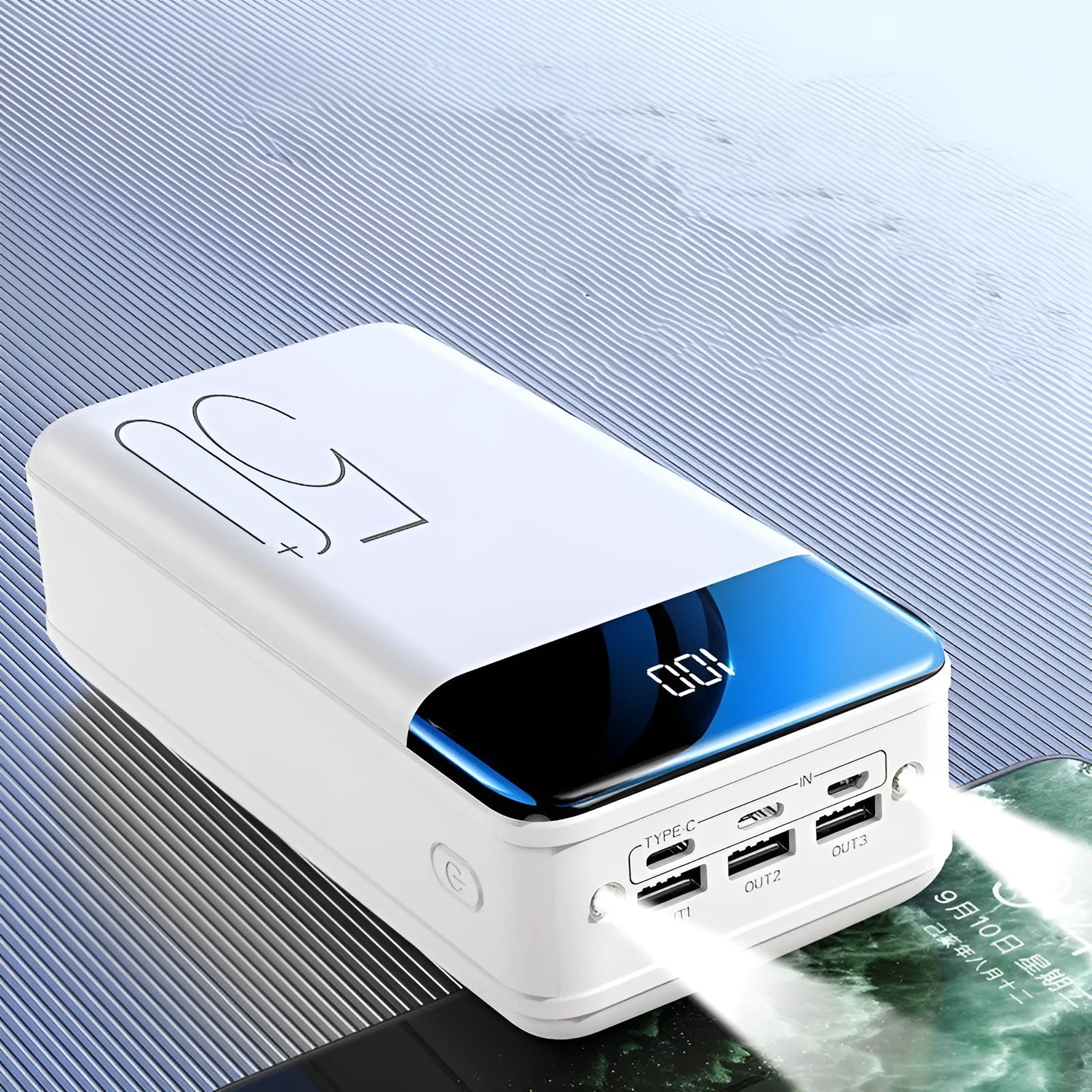 Large 50000mAh power bank with three USB ports in black or white plastic case