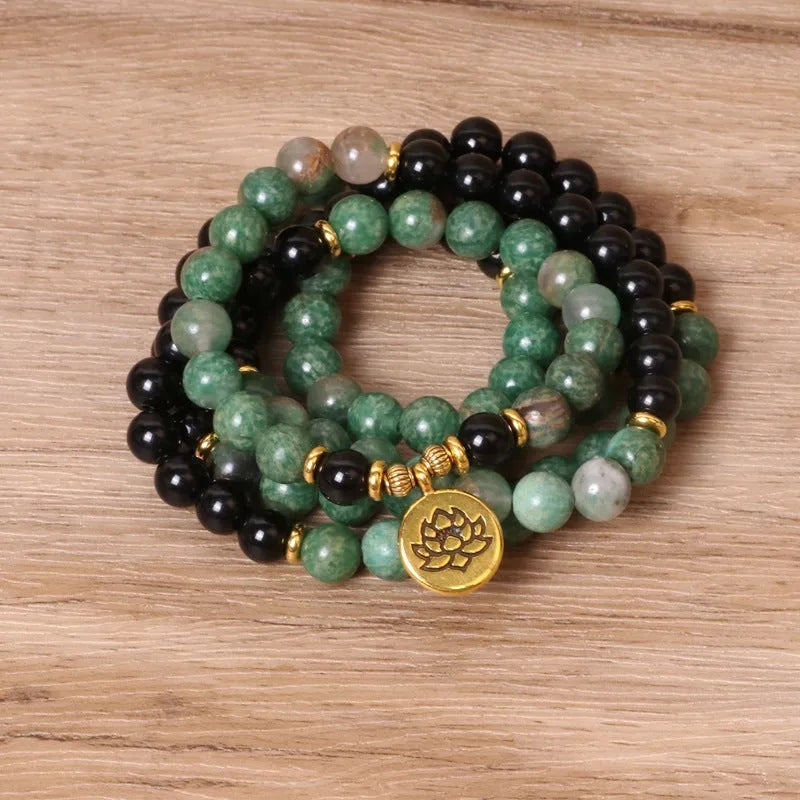 Green and black alloy beaded bracelet with elastic closure showing natural style design