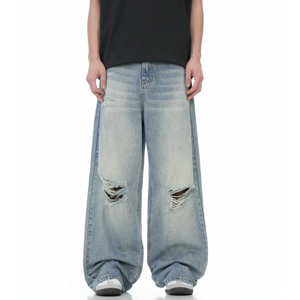 Blue straight-leg men's jeans with a zipper fly on a plain background.