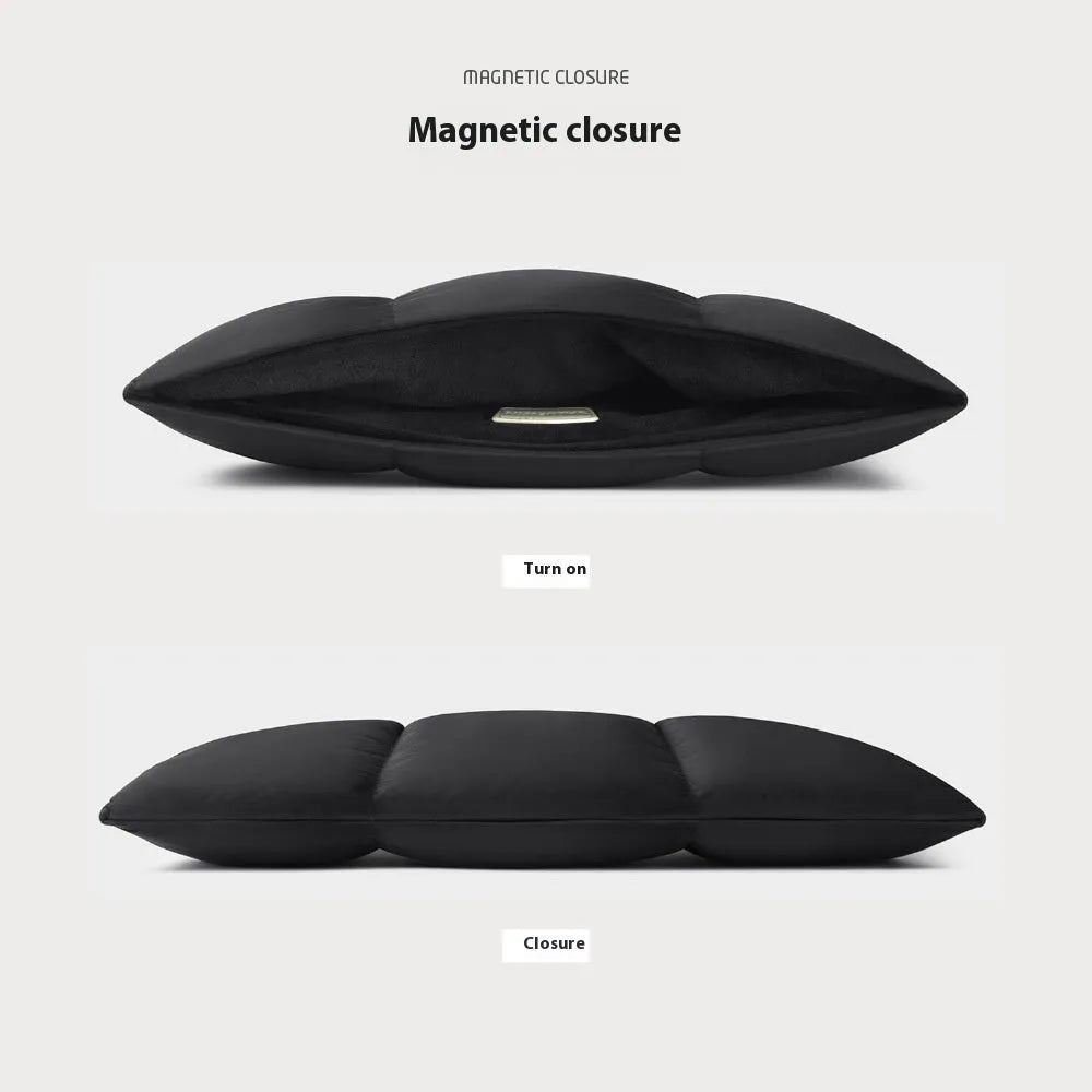 Soft fluffy polyester laptop sleeve in black and khaki colours on a table, showing sewing thread detail and size options.