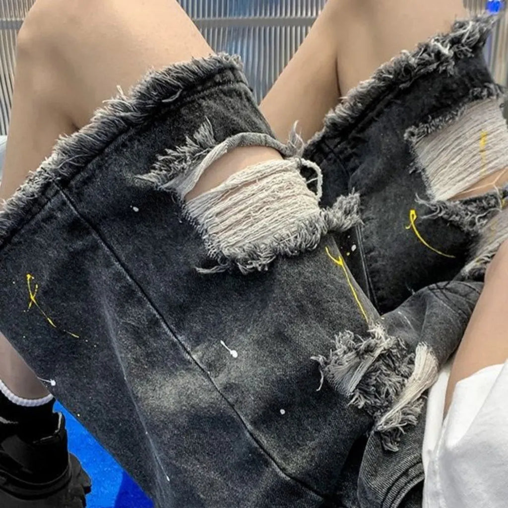 Men's casual denim shorts with water washed distressing and loose street style fit