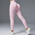 Women's solid colour yoga pants with hip-lifting mid-waist design for fitness activities