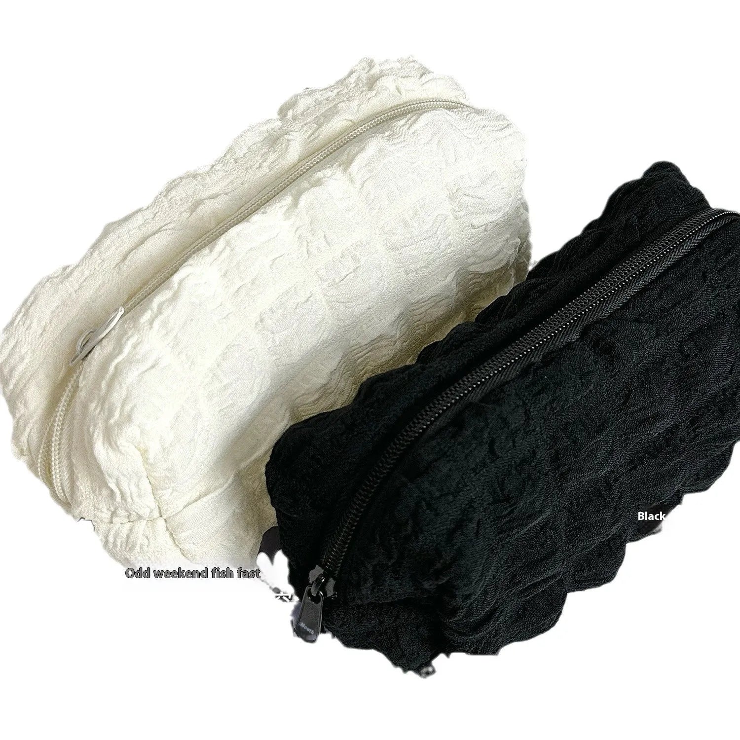 Beige and black cream puff style fabric pencil case made from polyester for pen organisation.