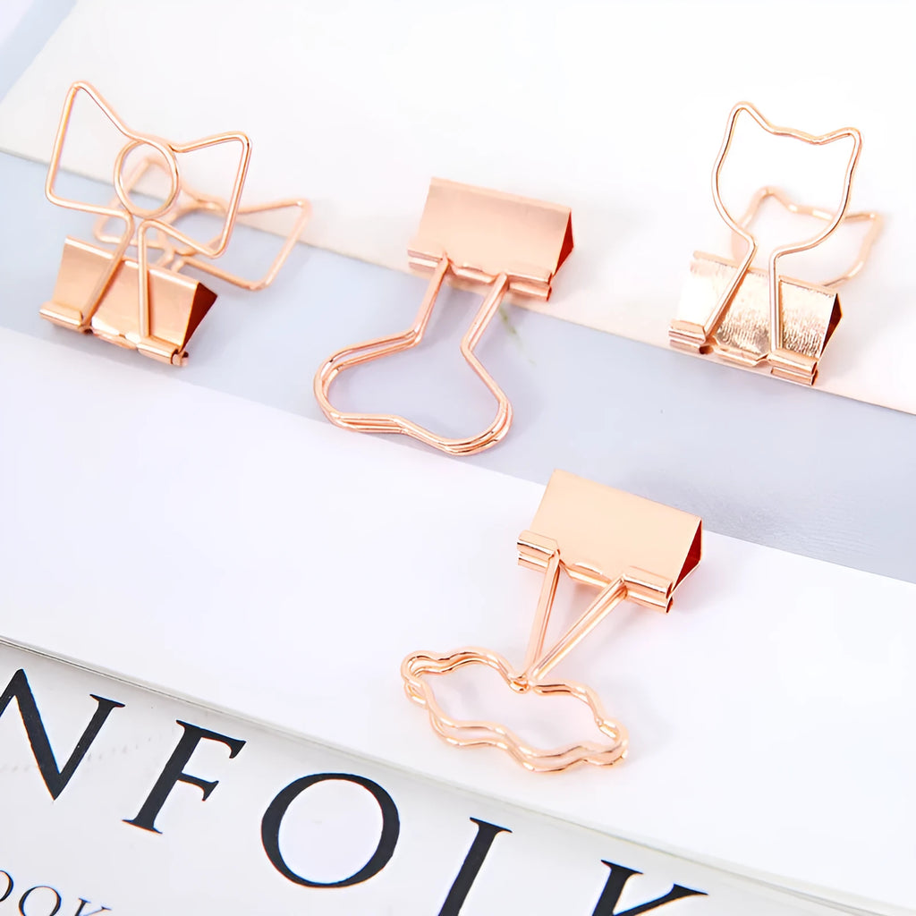 Gold metal paper clip with decorative charm attachment in flamingo design