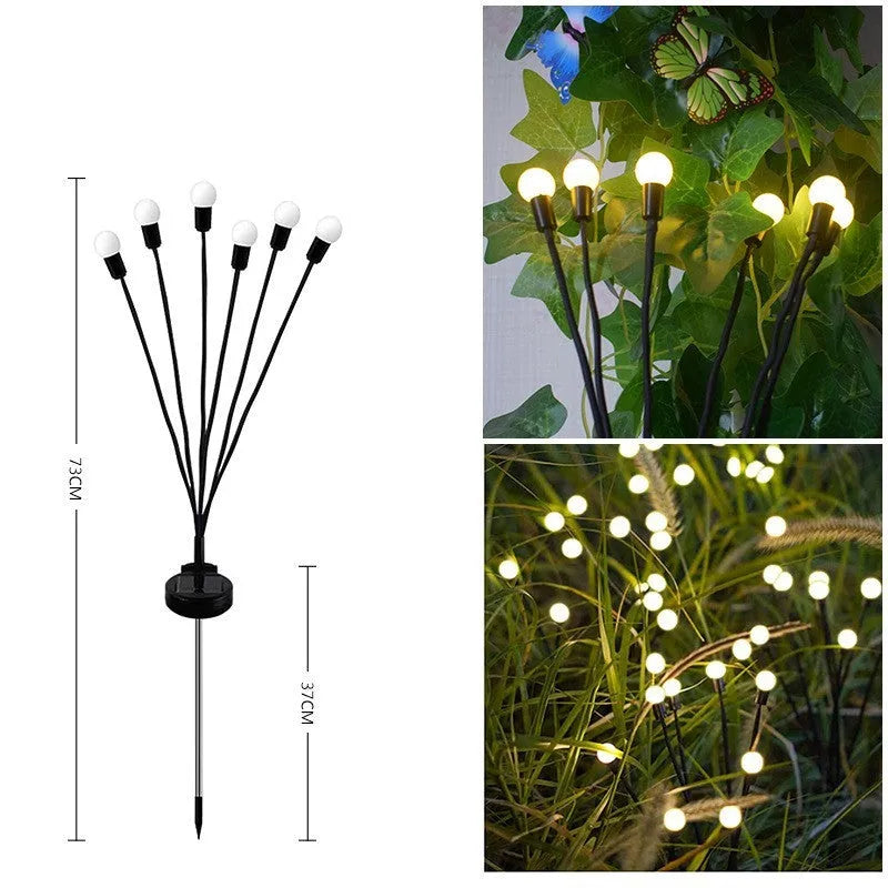 Solar-powered LED garden spike light with stainless steel ground plug stuck in soil.