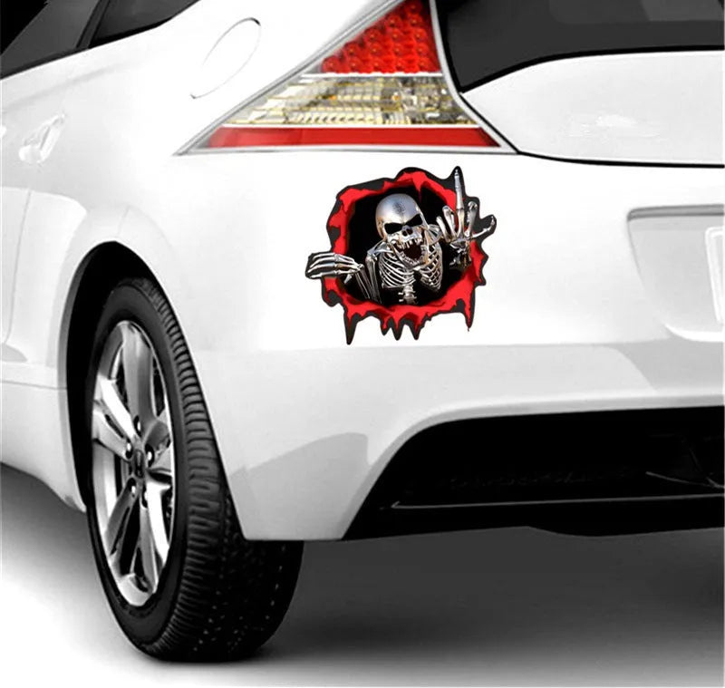 Close-up of a colourful reflective metal skull vinyl car sticker with a broken shell pattern.