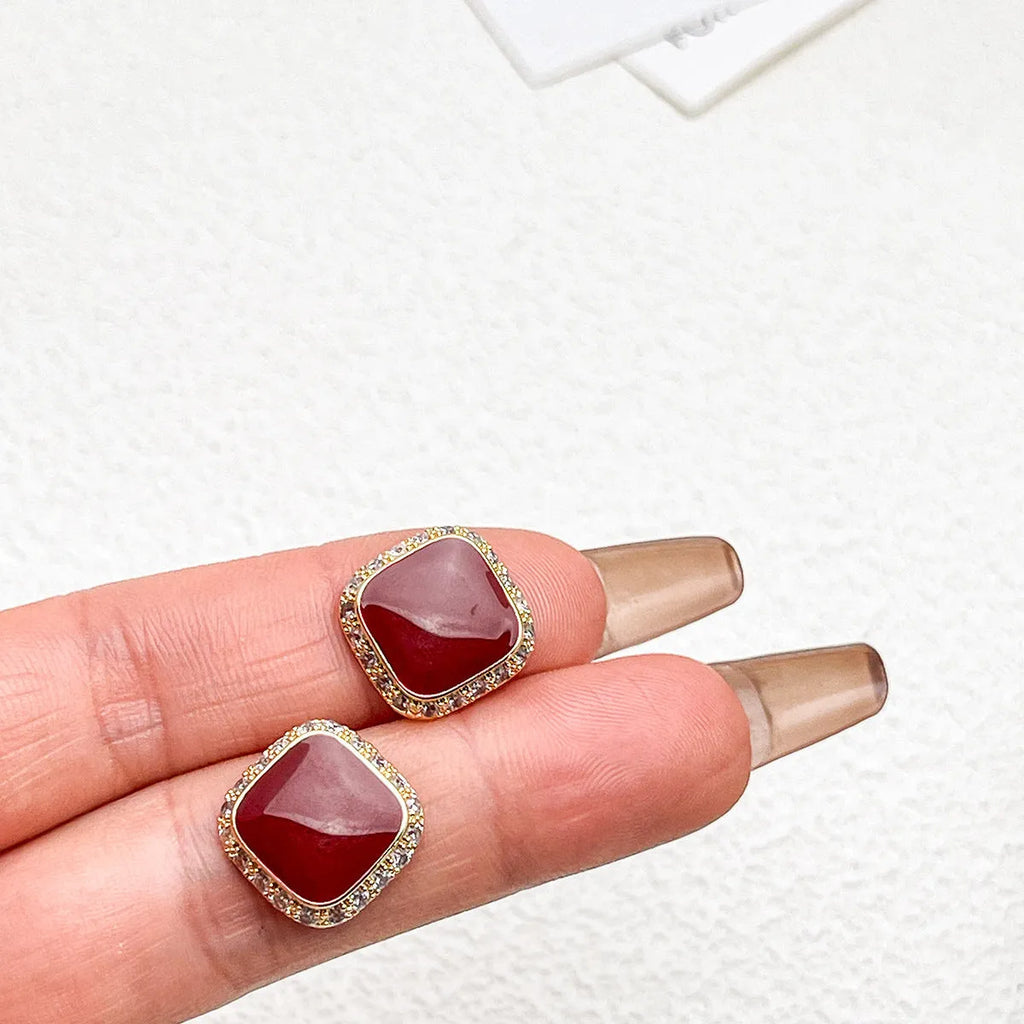 Red geometric square earrings with alloy construction and inlaid design detail