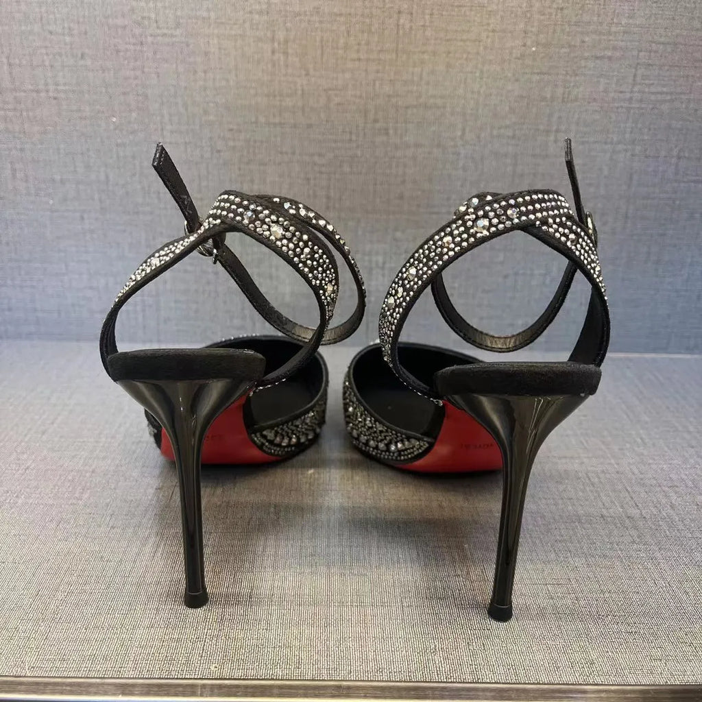 Women's black and silver hollow-cut stiletto high heels with pointed toes and red soles.