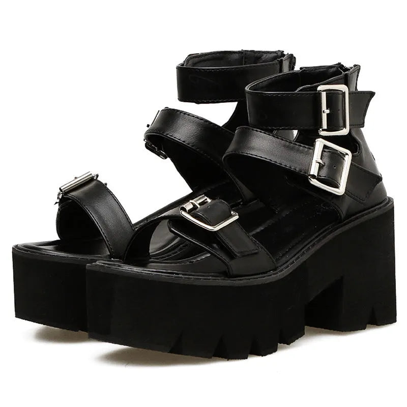 Black women's punk-style platform sandals with a chunky heel, thick sole, round toe, and back zipper.