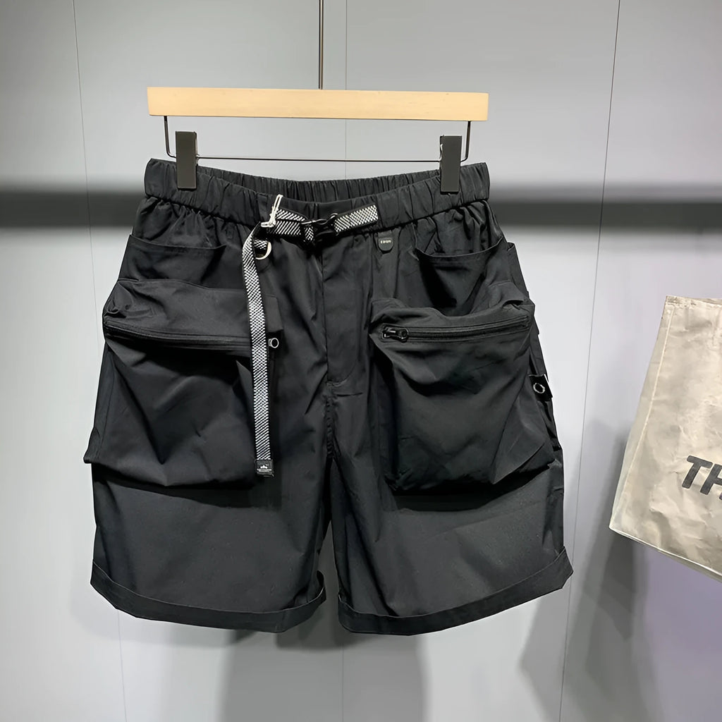 Men's black loose-fit workwear shorts with pockets in above-knee length