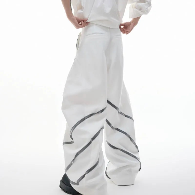 Men's trousers with deconstructed cut, metal striped rivets on pleats, and polyester fabric in black bottom colour