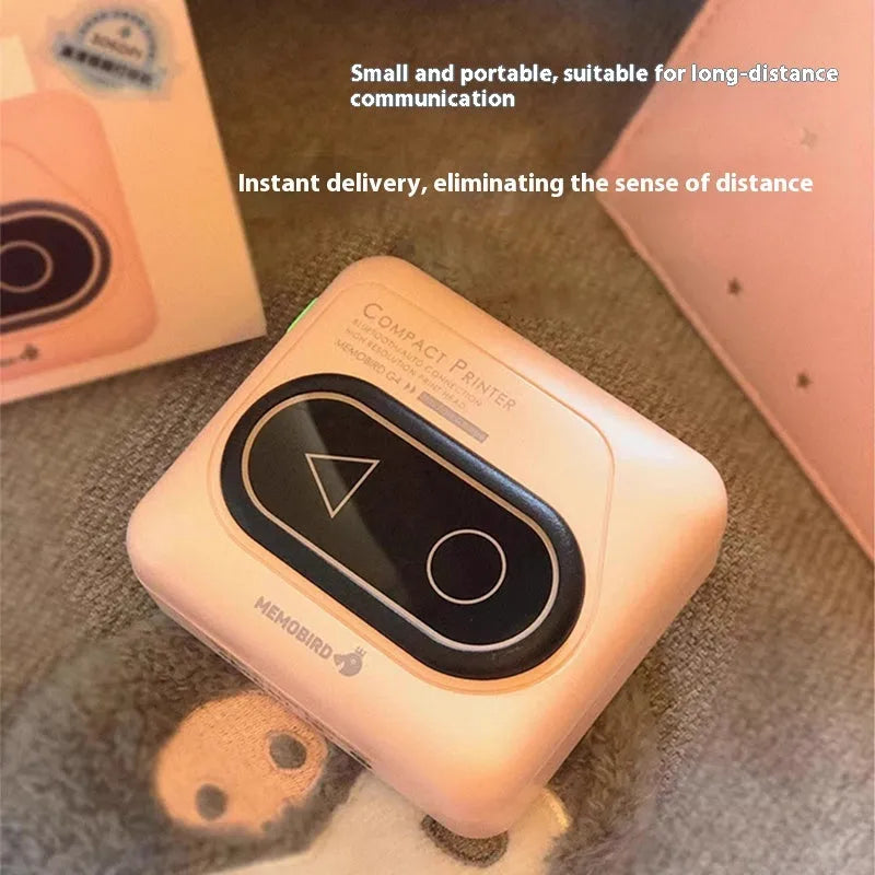 Avocado green coloured portable Bluetooth thermal mini printer next to a mobile phone
