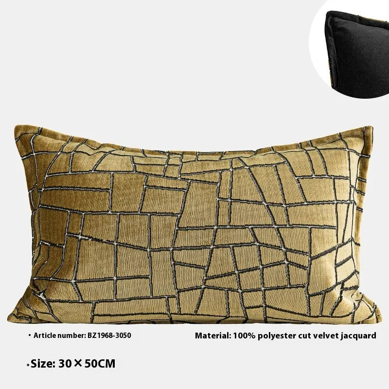 Geometric abstract patterned cushion in local gold colour, shown in square and lumbar sizes on a grey sofa.