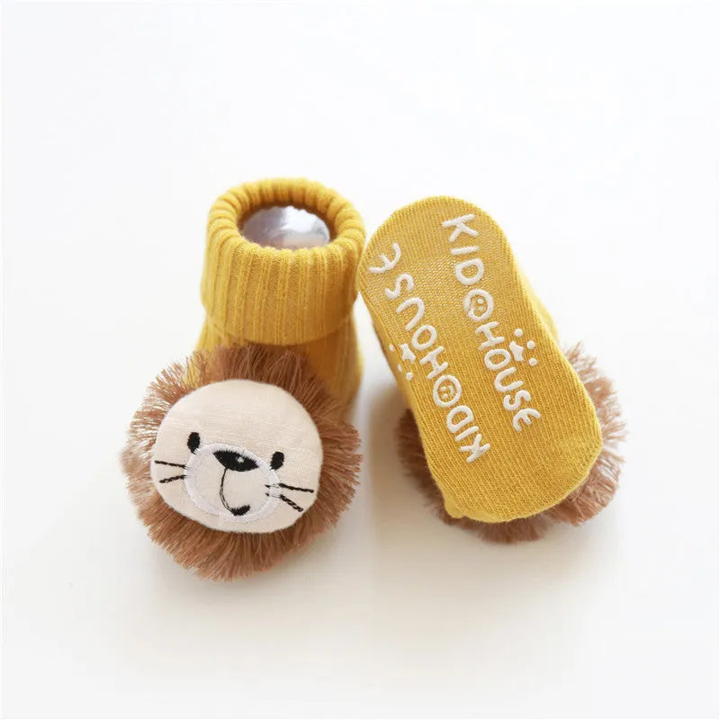 Cotton baby floor socks in various designs including blue bow and lion, showing sizes for infants 0-3 months