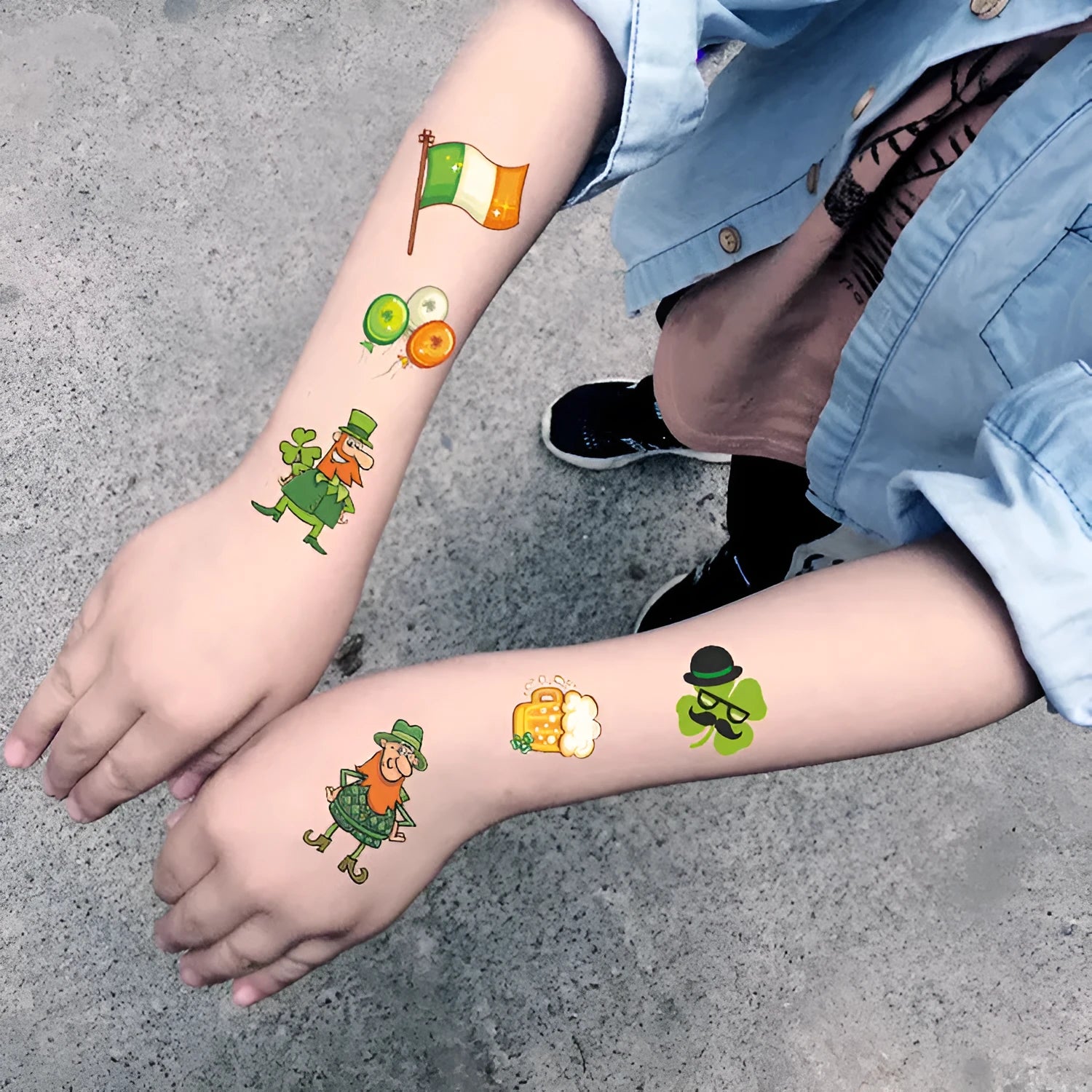 Temporary tattoo sticker sheet with St. Patrick's Day clover designs for Irish festival face painting