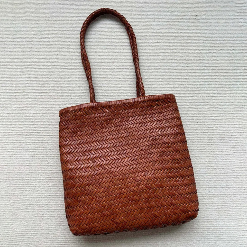 Handmade brown woven tote bag made from vintage top layer cowhide leather with a three-dimensional pocket.