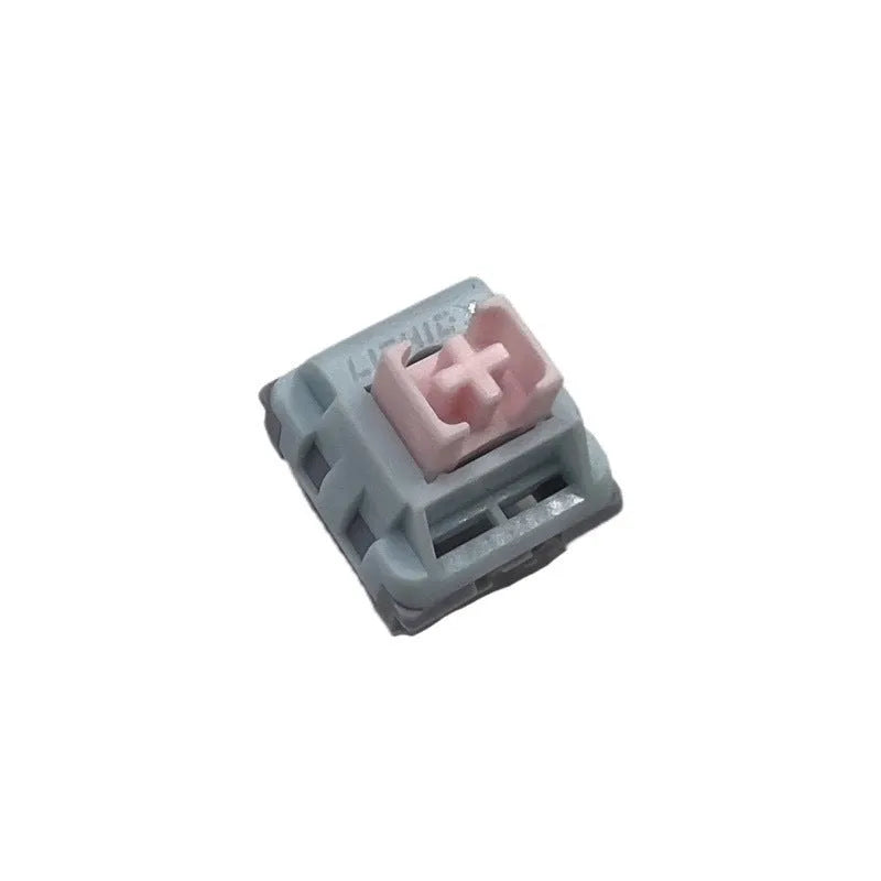 Four Dew Axis-4 mechanical keyboard switches showing three-colour shaft core and bridge plug-in shell design