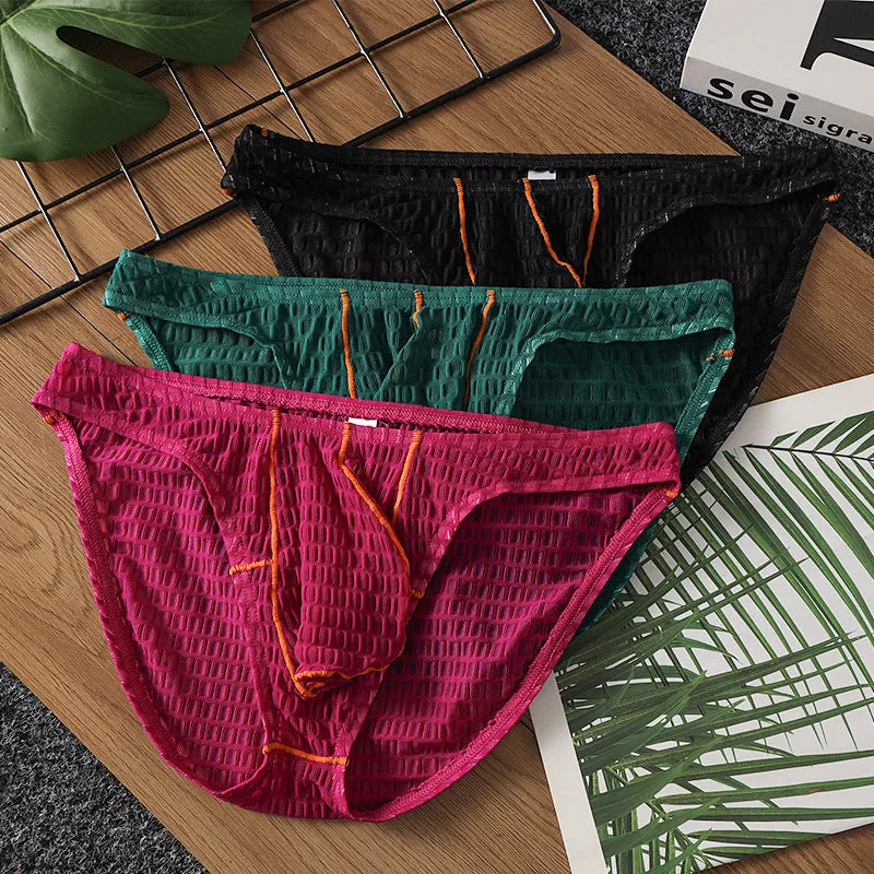 Men's solid colour low waist lace briefs on a white background.