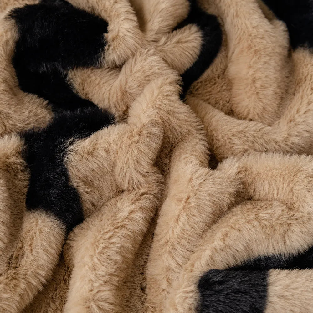 Zebra pattern flannel sofa cover with non-slip properties in caramel colour on a sofa