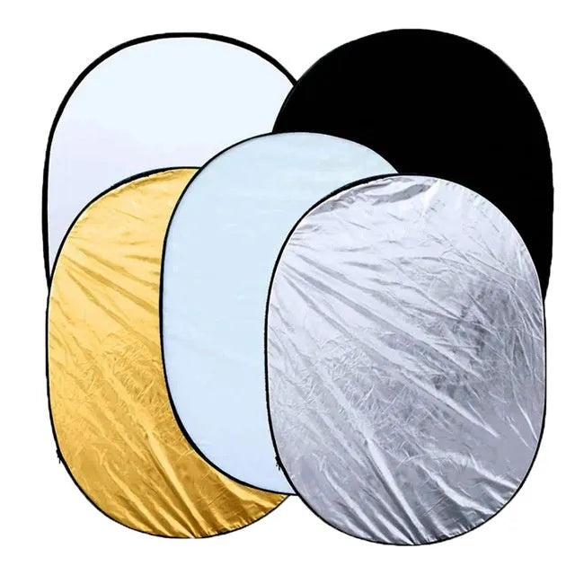 Collapsible five-in-one photography light reflector showing gold, silver, white, black, and translucent surfaces.