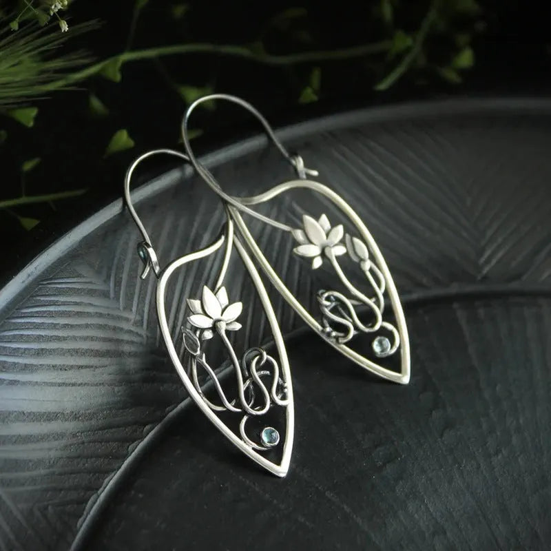 Silver lotus vine design rhinestone earrings with floral geometric pattern