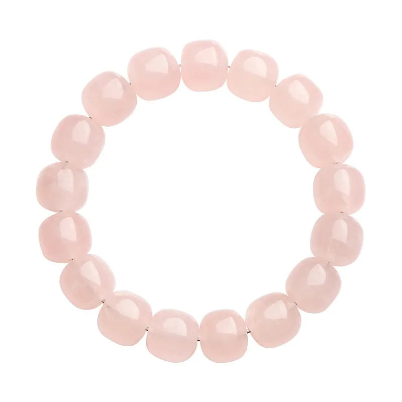 Close-up of a pink crystal barrel bead bracelet with 11-12mm beads on a wrist.