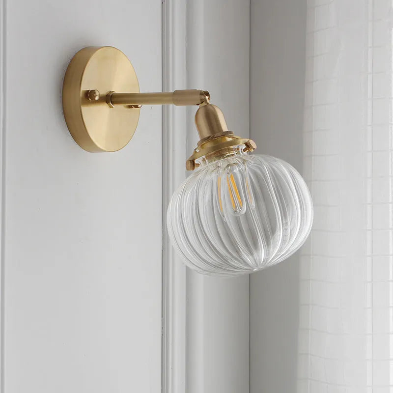 Glass wall lamp with transparent shade for living room or bedroom lighting