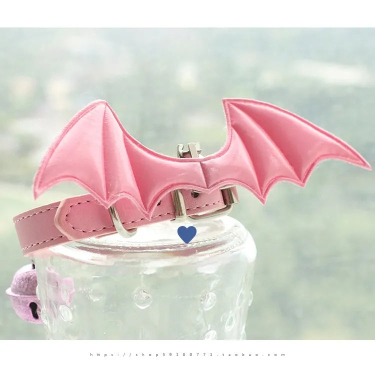 Black patent leather choker collar with devil wings design and bell attachment