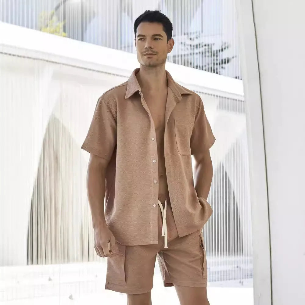 Elastic waist shorts and short sleeve top two-piece set in a neutral colour on a hanger.