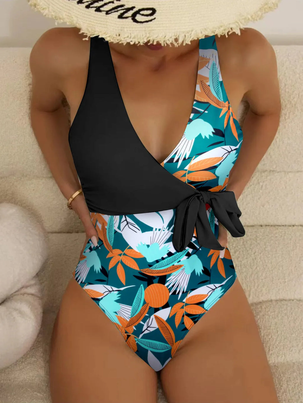 Women's high-waist one-piece swimsuit in a printed pattern, showing conservative cut and style.