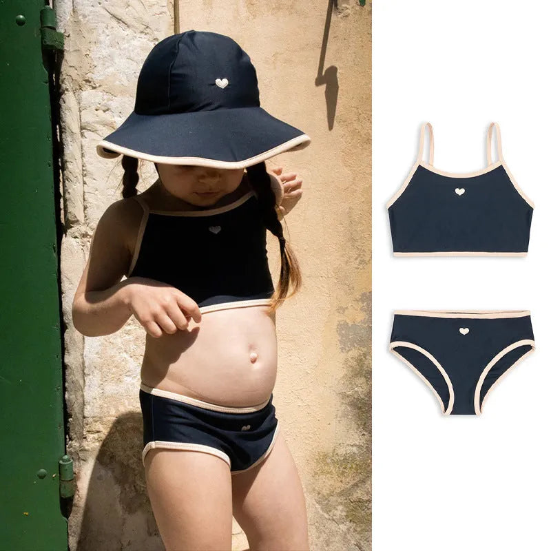 Dark blue girls' split swimsuit briefs made from high elasticity polyester fabric for swimming.