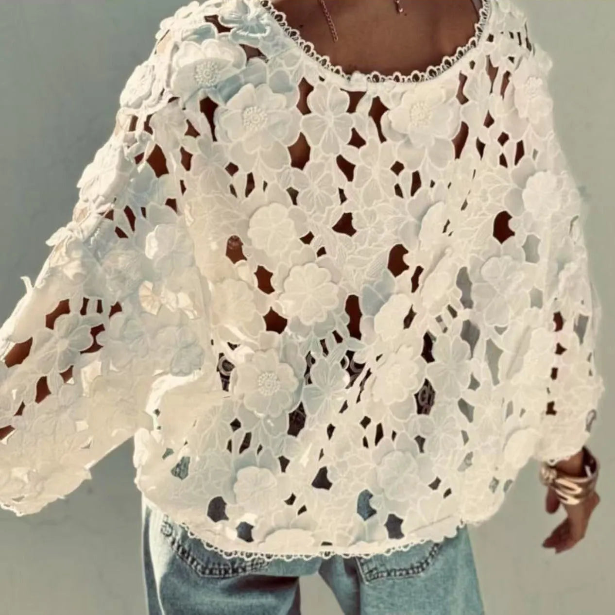 Black lace cardigan shirt with 3D floral embroidery and a V-neck, shown on a hanger.