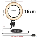 Adjustable live phone stand extended to its maximum 110cm height with a mobile phone secured on top.