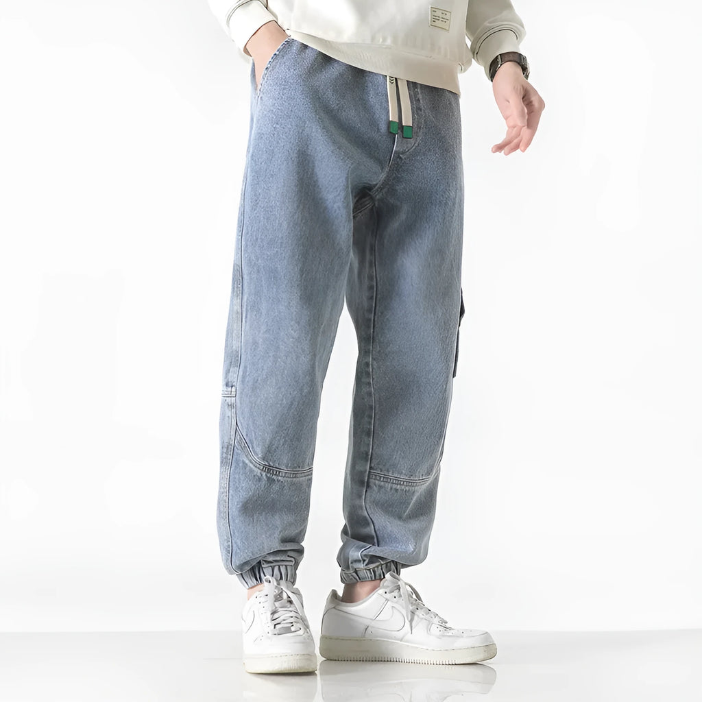Men's loose-fit tapered cotton trousers in black, blue or grey with mid-waist design