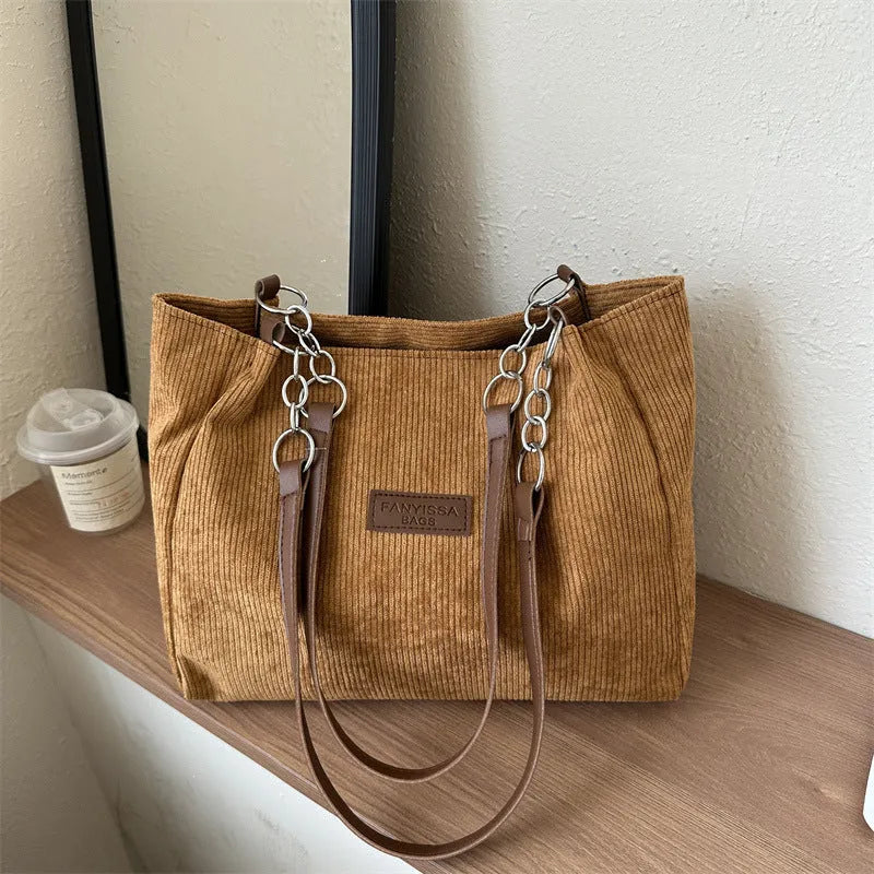 Corduroy one-shoulder tote handbag in street trend style with three-dimensional pocket