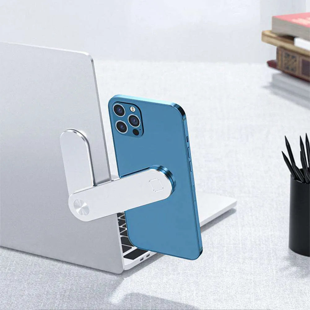 Black aluminium laptop phone holder with magnetic mount attached to laptop edge