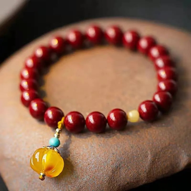 Handcrafted gold cinnabar wave bracelet with copper beads in national style design