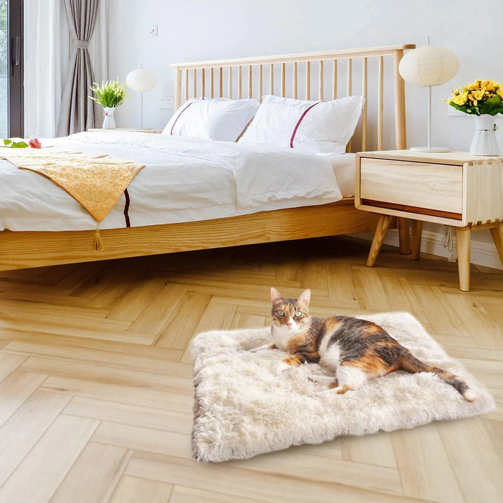 Grey pet plush sleeping pad measuring 61cm by 51cm with a black non-slip bottom.