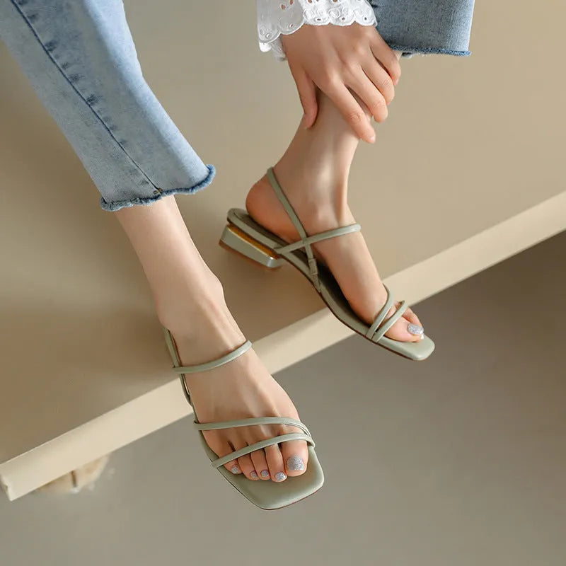 Women's flat strap open-toed Roman sandals in Microfiber with a square toe, shown in beige colour.