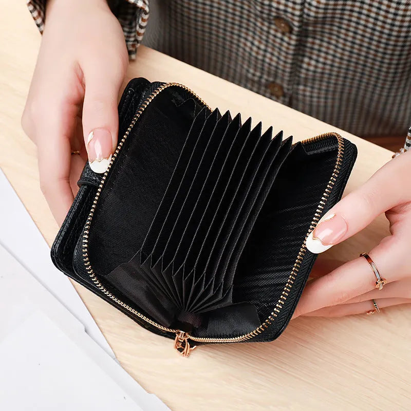 Beige women's short pu wallet with lychee pattern and sewing thread detail.