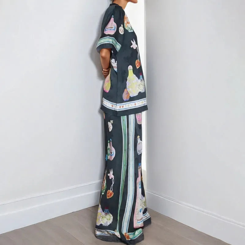 Black two-piece cardigan and pants set with cartoon animation pattern for women