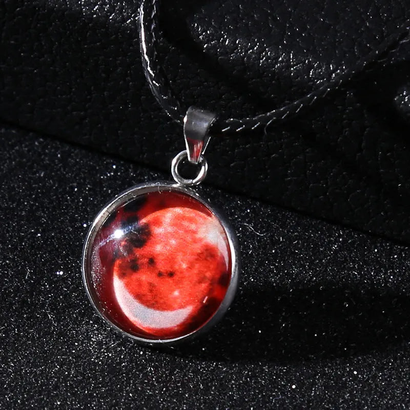 Luminous moon and constellation pendant necklace on a chain with an extension, shown in one of ten possible colours.