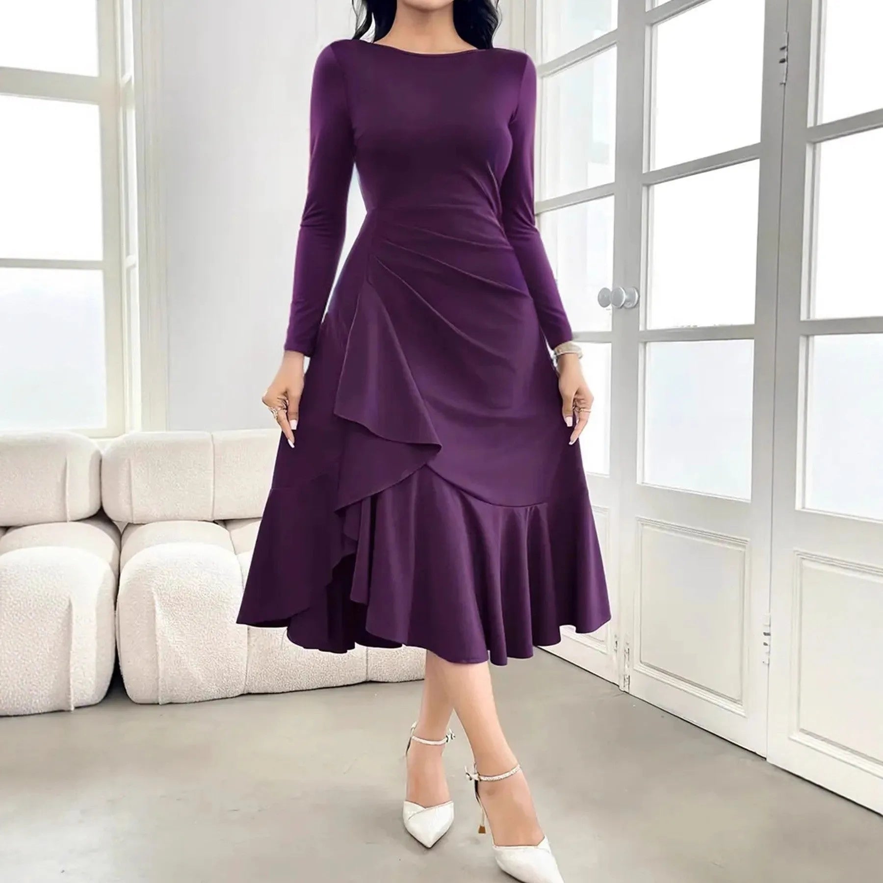 Purple women's long sleeve dress with round neck and ruffle details on a hanger.